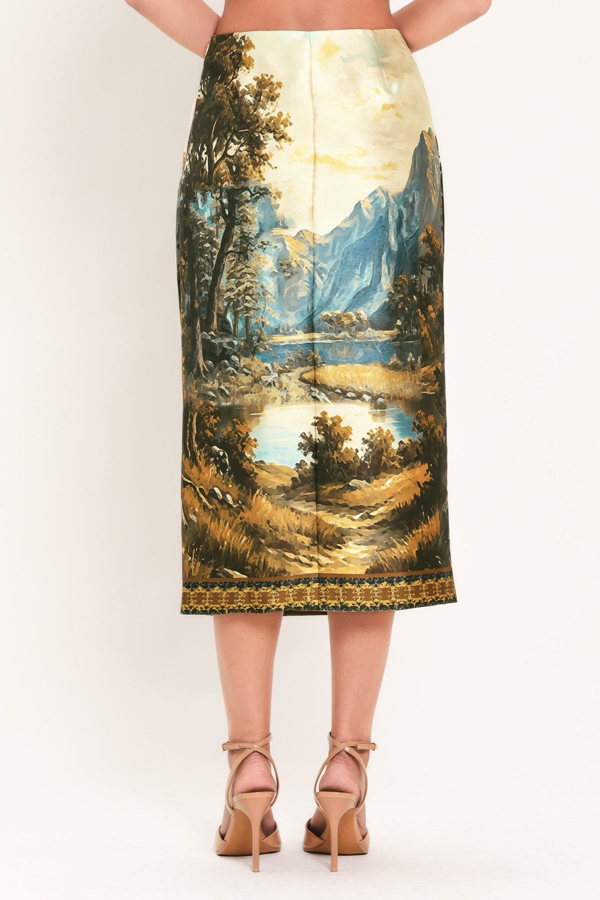Back view: cream multi woven pencil skirt with landscape scene and straight mid-calf hem