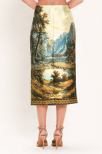 Back view: cream multi woven pencil skirt with landscape scene and straight mid-calf hem