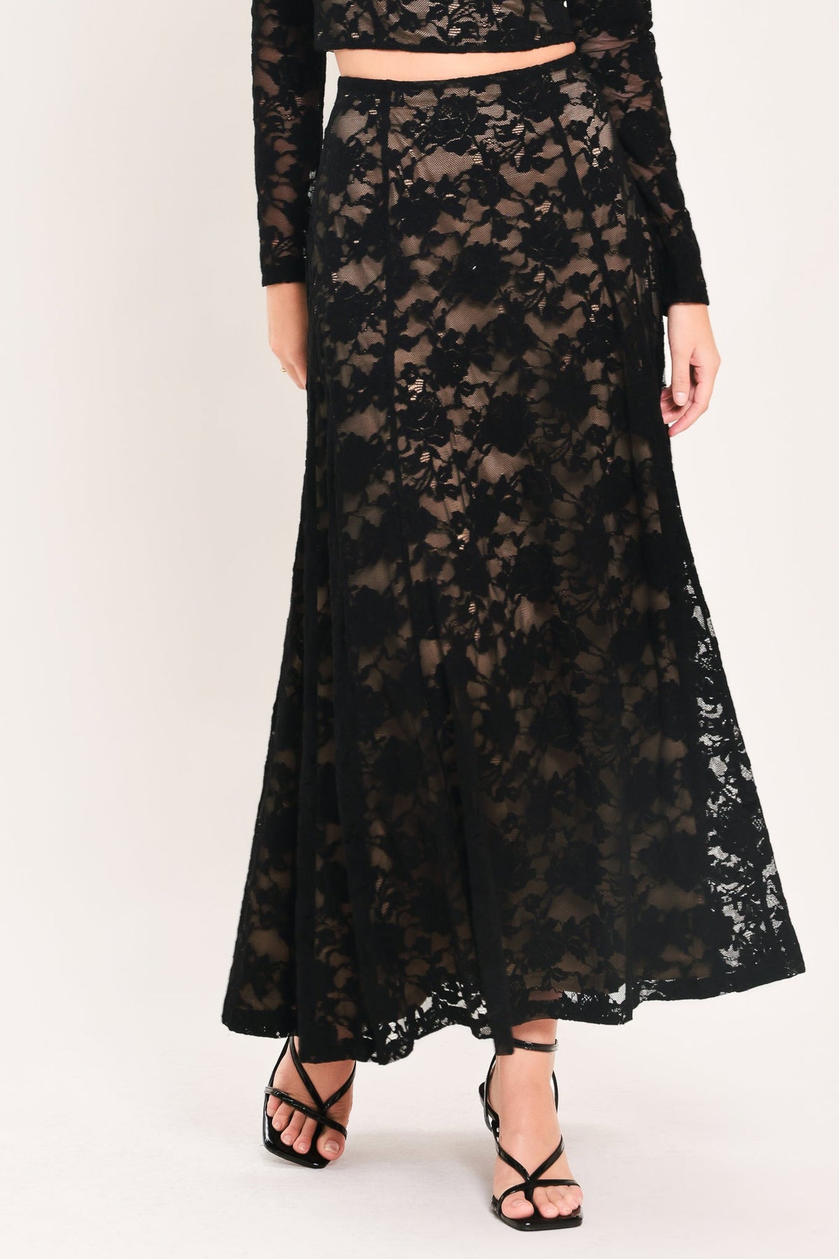 Black lace circle skirt with sheer floral pattern and ankle-length hem