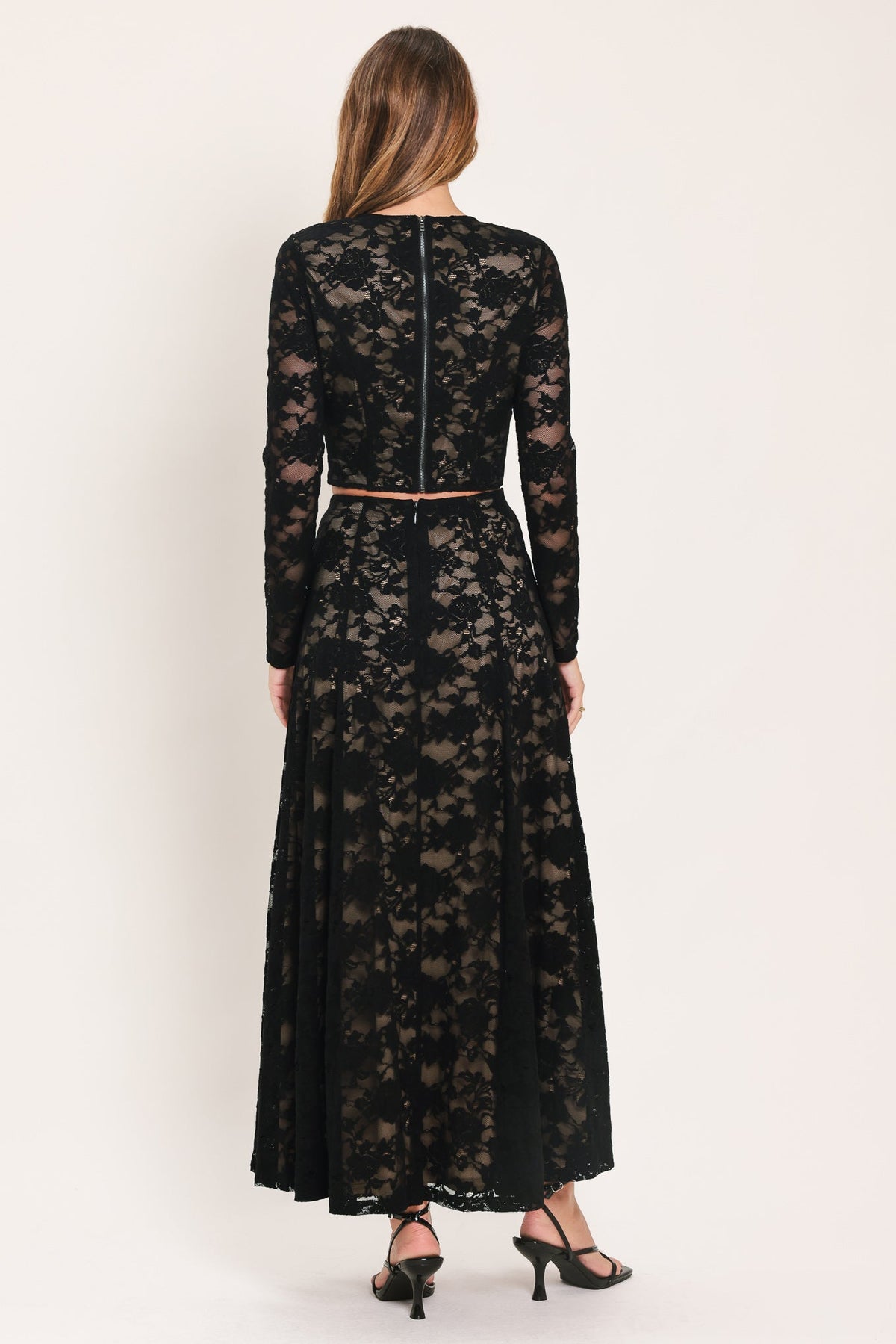 Black lace midi circle skirt, back view with vertical seam and full flare