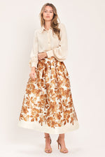Cream midi skirt with rust floral print, gathered waistband, full A-line shape