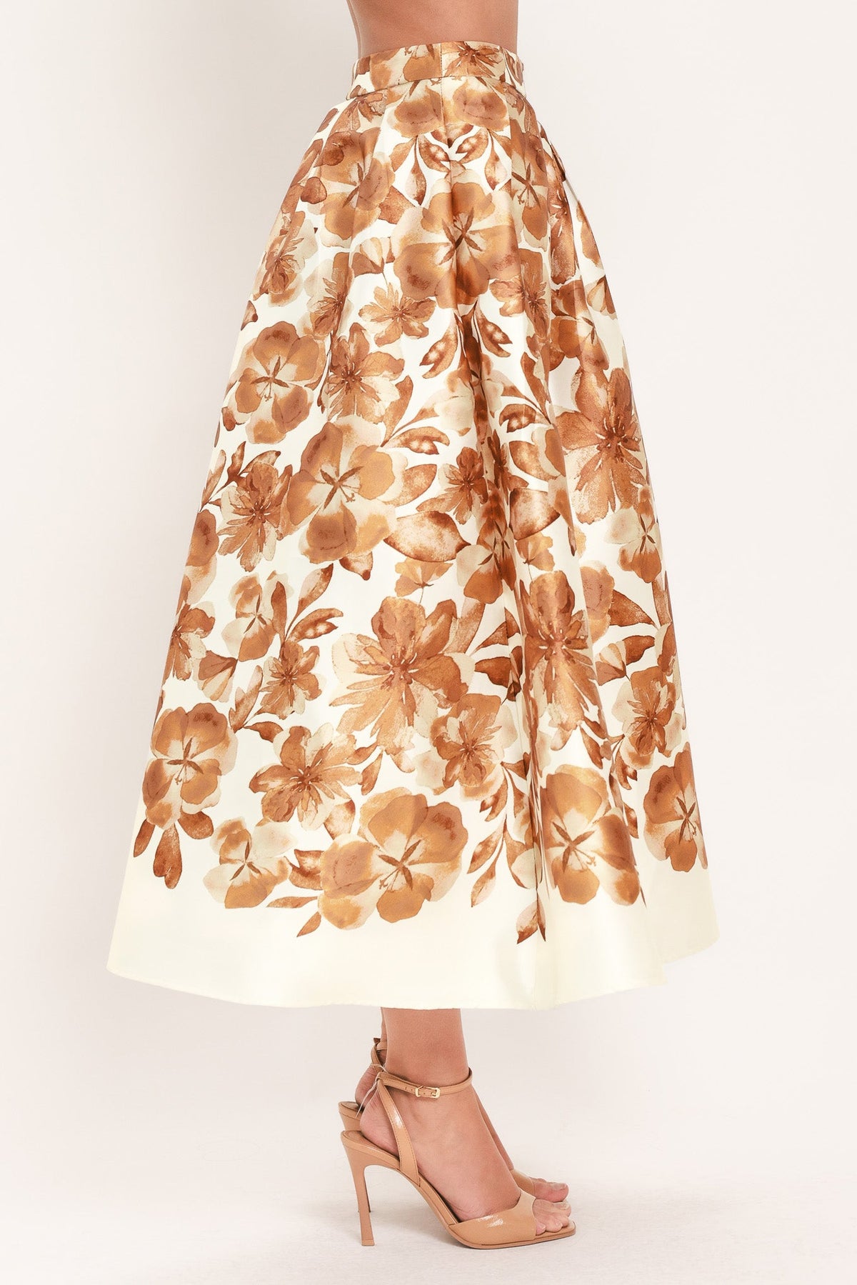 Cream midi skirt with rust floral print, gathered waist and flared hem