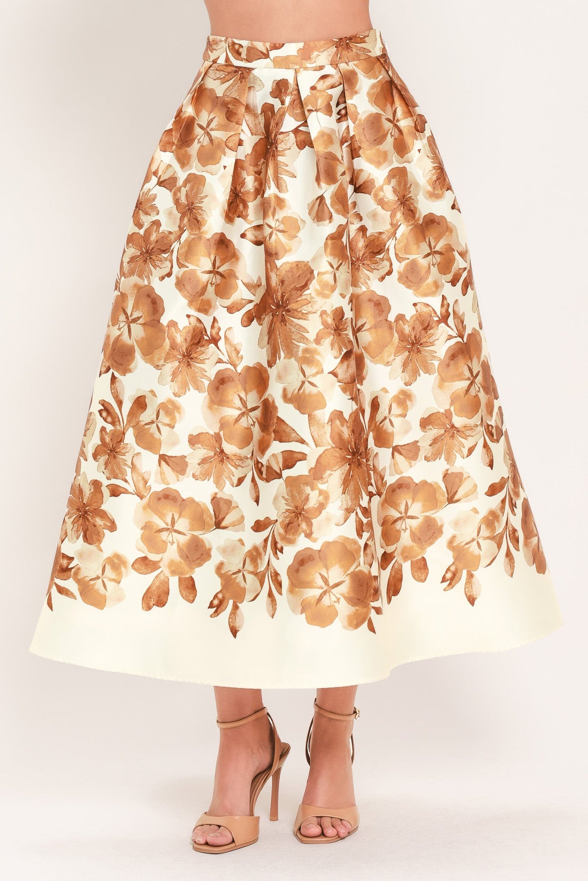 Cream midi skirt with rust floral print, gathered waistband, full skirt silhouette