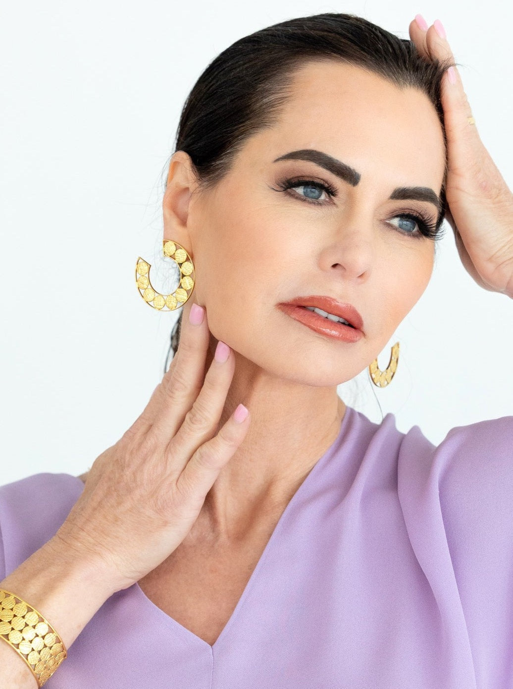 Gold textured hoop earrings, semicircle cutout design