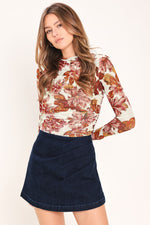 Dark indigo denim skort with front pockets and fitted A-line cut