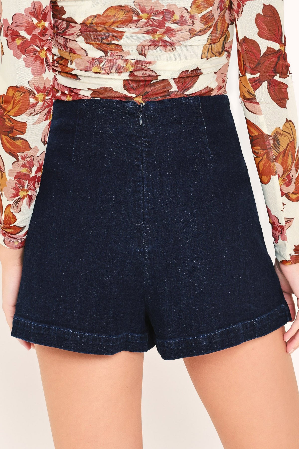 Dark indigo denim skort with front panel seams and side pockets