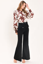 Black wide-leg pants with high waist belt and front button pockets