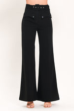 Black wide-leg woven pants with high waist belt and snap pockets