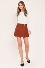 Rust Tencel side-zip skort with gold-toned tab, structured A-line front panel