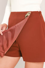 Rust Tencel skort with side zip; front overlap panel and A-line skirt silhouette