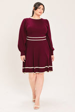 Wine knit mini dress with long puff sleeves, crew neck, and light stripe waistband.