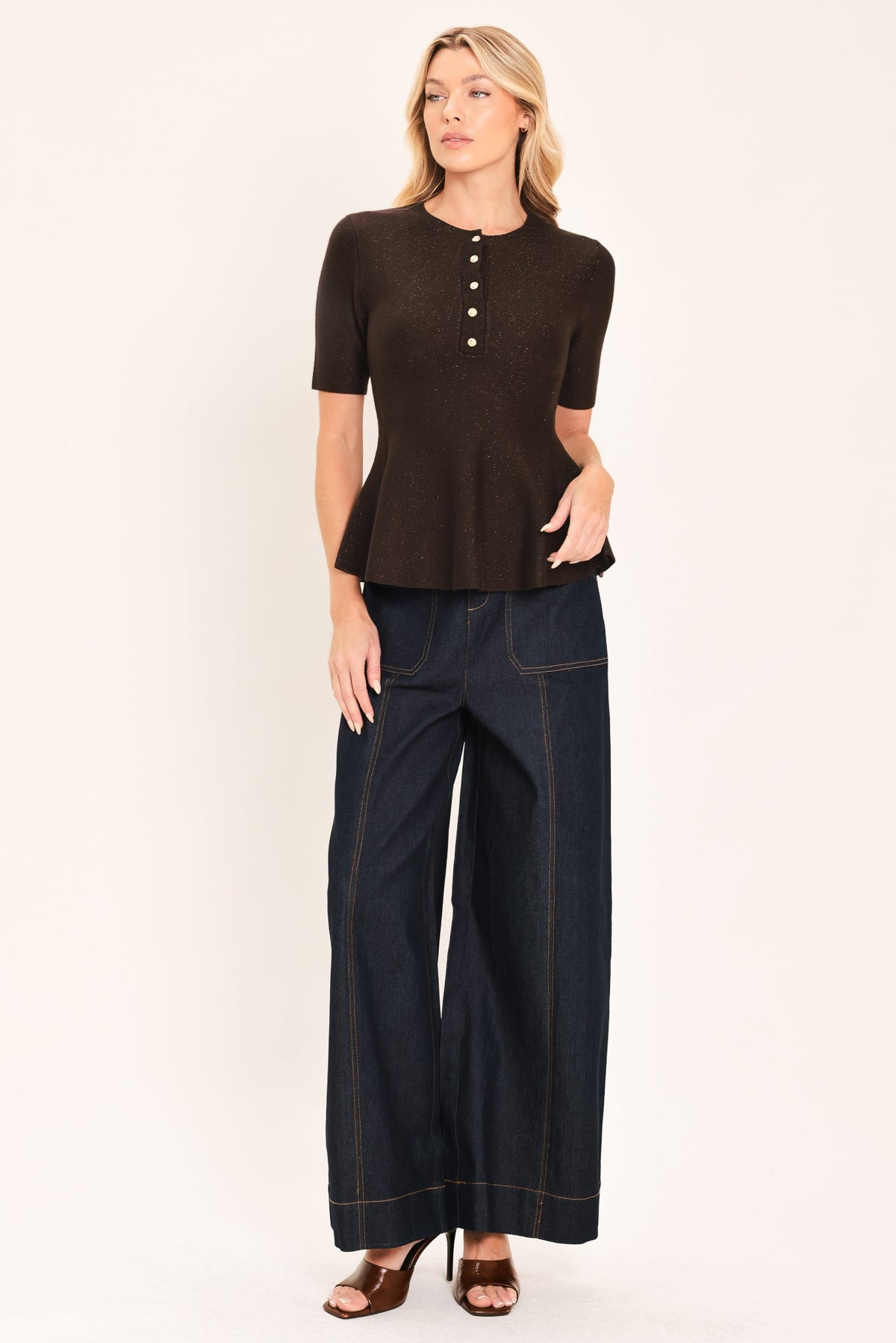 Dark brown peplum knit sweater top with short sleeves and buttoned henley neckline