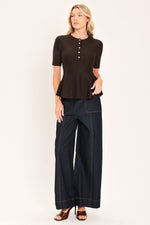 Dark brown peplum knit sweater top with short sleeves and buttoned henley neckline