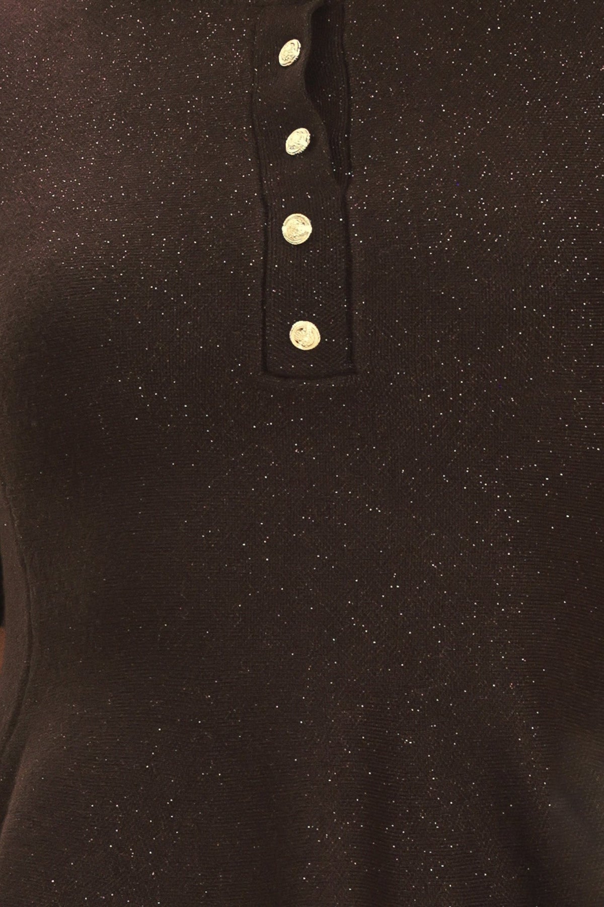 Close-up of dark brown sweater top: vertical henley placket with gold buttons