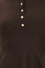 Close-up of dark brown sweater top: vertical henley placket with gold buttons