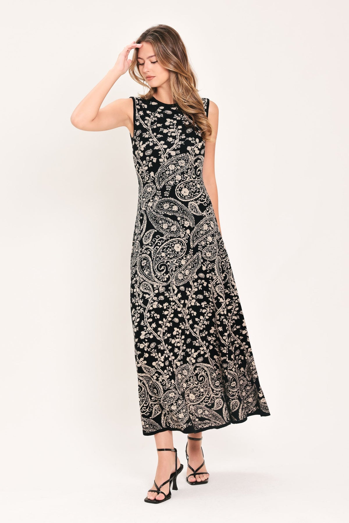 Black paisley jacquard sleeveless midi sweater dress with flared skirt