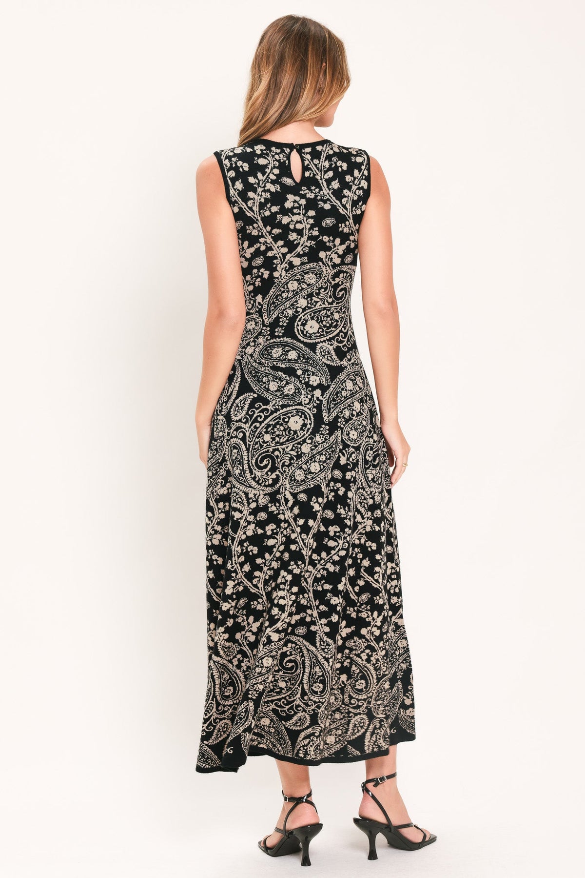 Back view of black sleeveless midi sweater dress with keyhole cutout