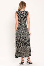 Back view of black sleeveless midi sweater dress with keyhole cutout