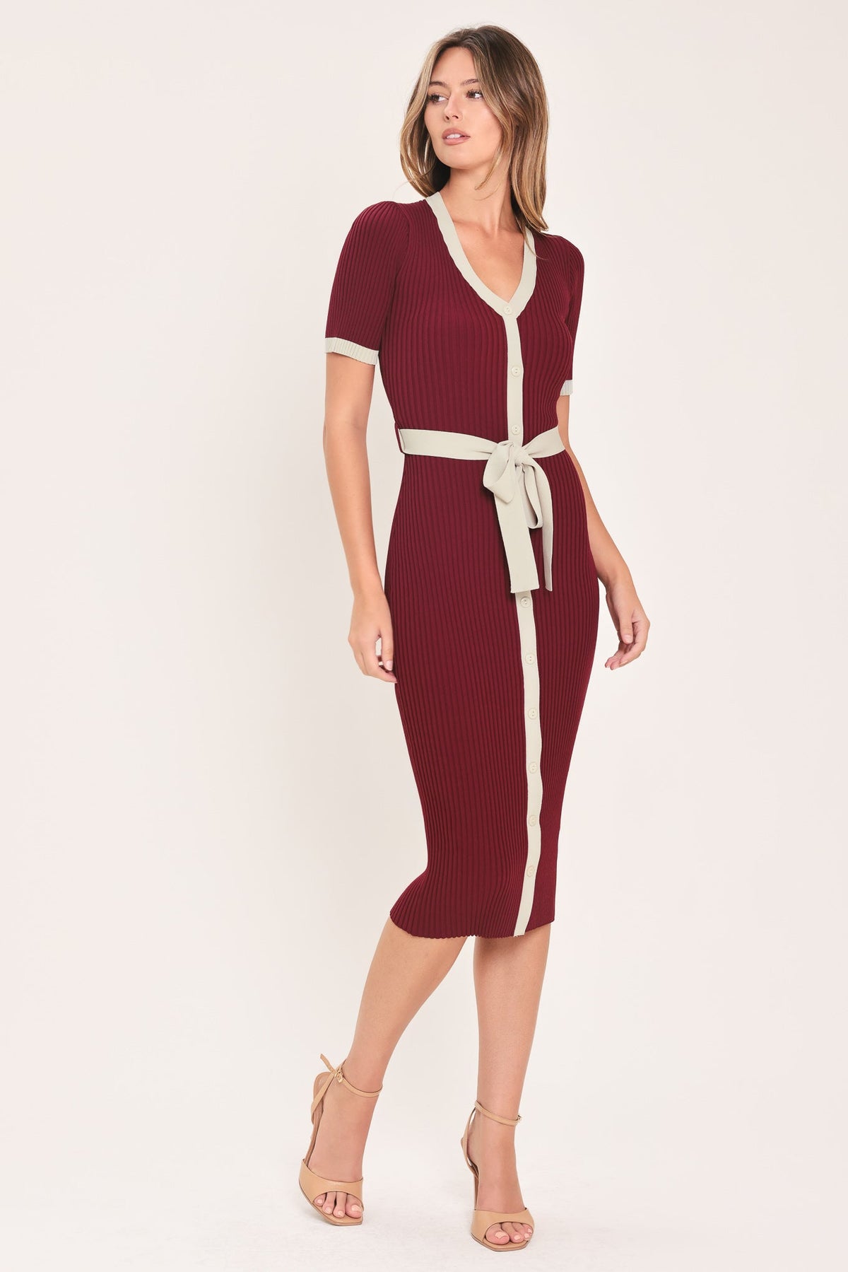 Burgundy ribbed knit midi dress with cream button placket, V-neck trim, and waist tie