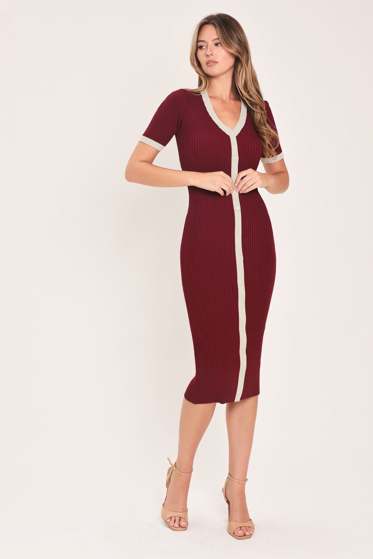 Burgundy ribbed knit midi dress with cream V-neck trim and tied waist belt