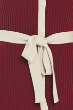 Belt detail on burgundy ribbed knit midi dress with cream waist tie and button placket