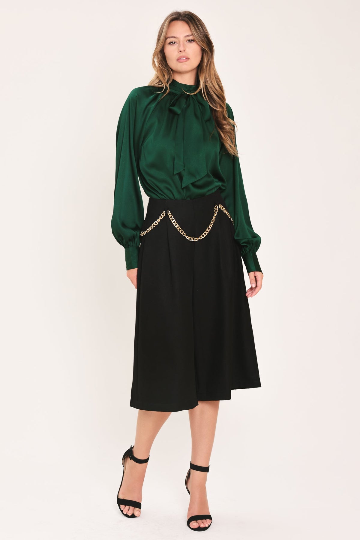 Hunter green tie-neck raglan top with bow collar and gathered cuffs