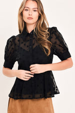 Black polka-dot woven button top with short puff sleeves and ruffled peplum.