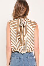 Back view of mocha striped woven sleeveless top with high neck and bow tie