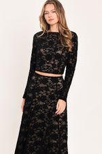 Black floral lace long-sleeve crop top with high neckline and scalloped lace texture