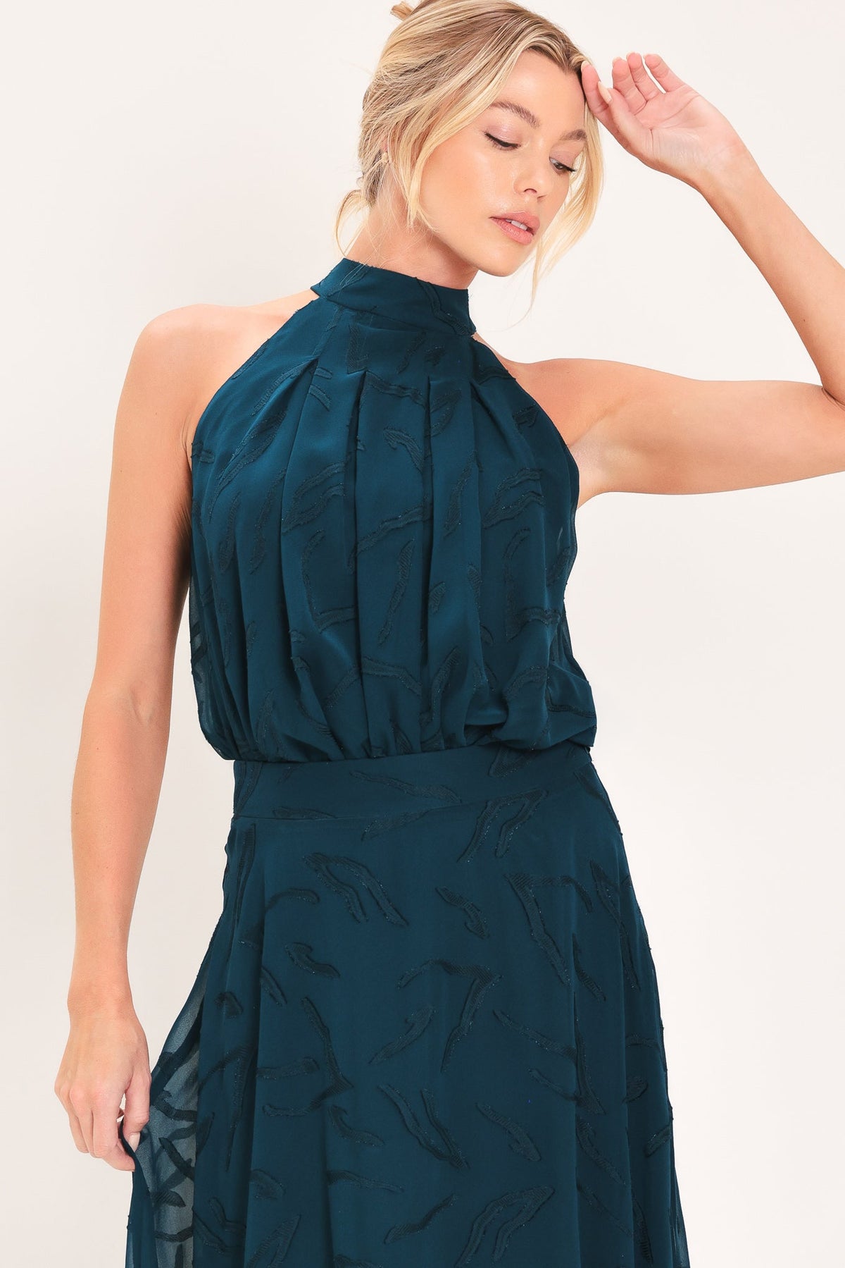 Teal sleeveless halter neck woven jacquard top with draped high collar