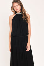 Black halter top and wide-leg pants set with embellished neckline and flowy tiers