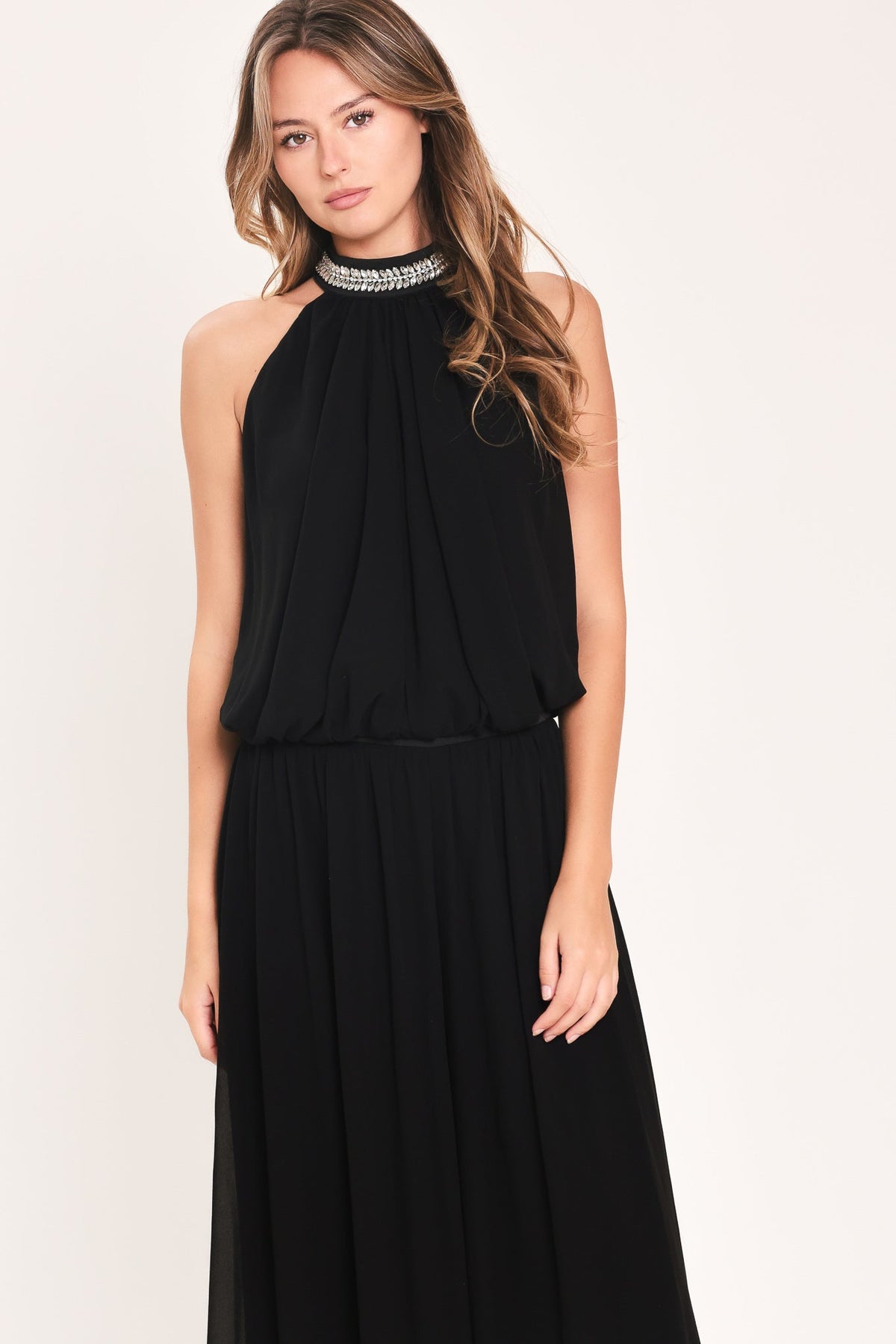 Black halter top and wide-leg pants set with embellished neckline and flowy tiers