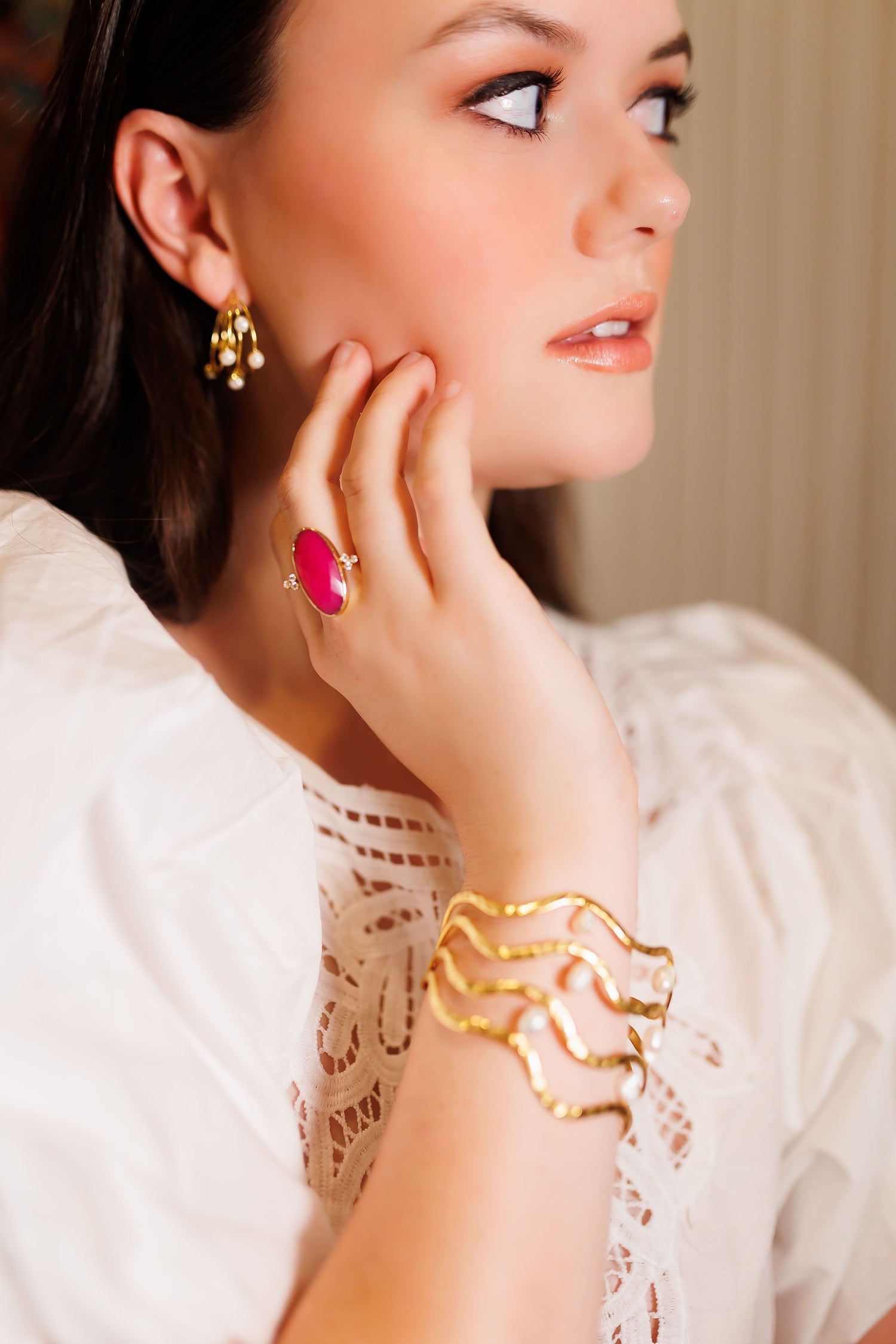Small gold hoop earrings with pearl drops