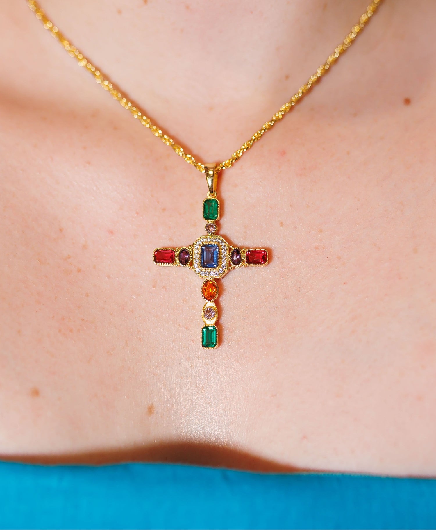 Gold cross pendant necklace with multicolor square stones and beaded chain