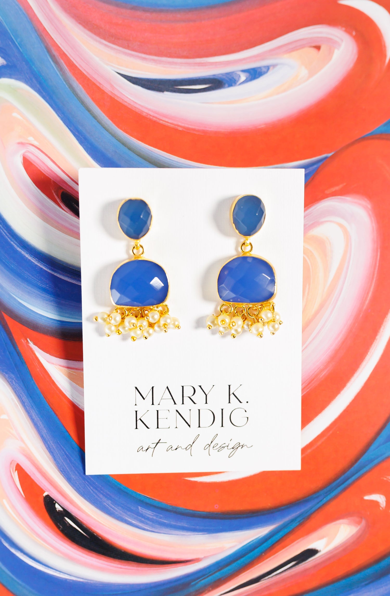 Blue gemstone drop earrings with gold fringe detailing
