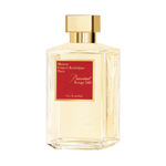 Amber eau de parfum bottle with gold cap and Baccarat Rouge 540 red label