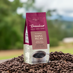 Teeccino Maple Pecan chicory herbal coffee bag on coffee grounds outdoors