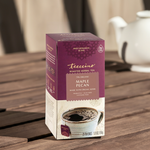 Teecino roasted herbal tea box, Maple Pecan prebiotic, caffeine-free on wooden table.