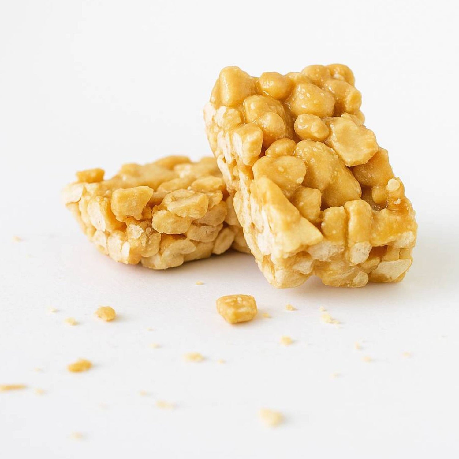 Caramelized cashew brittle pieces, golden crunchy snack clusters