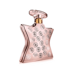 Rose-gold Eau de Parfum bottle with 'GOLD COAST' cap and NYC logo pattern