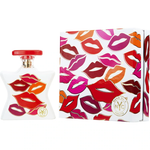 White perfume bottle and matching box with colorful lip-print graphics