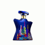 Eau de parfum bottle with blue glass, colorful pixel skyline design, and gold cap
