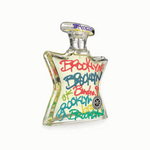 Clear Eau de Parfum bottle with colorful Brooklyn graffiti label and silver cap