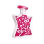 Bond No.9 ChinaTown eau de parfum bottle, pink with white floral label and red cap