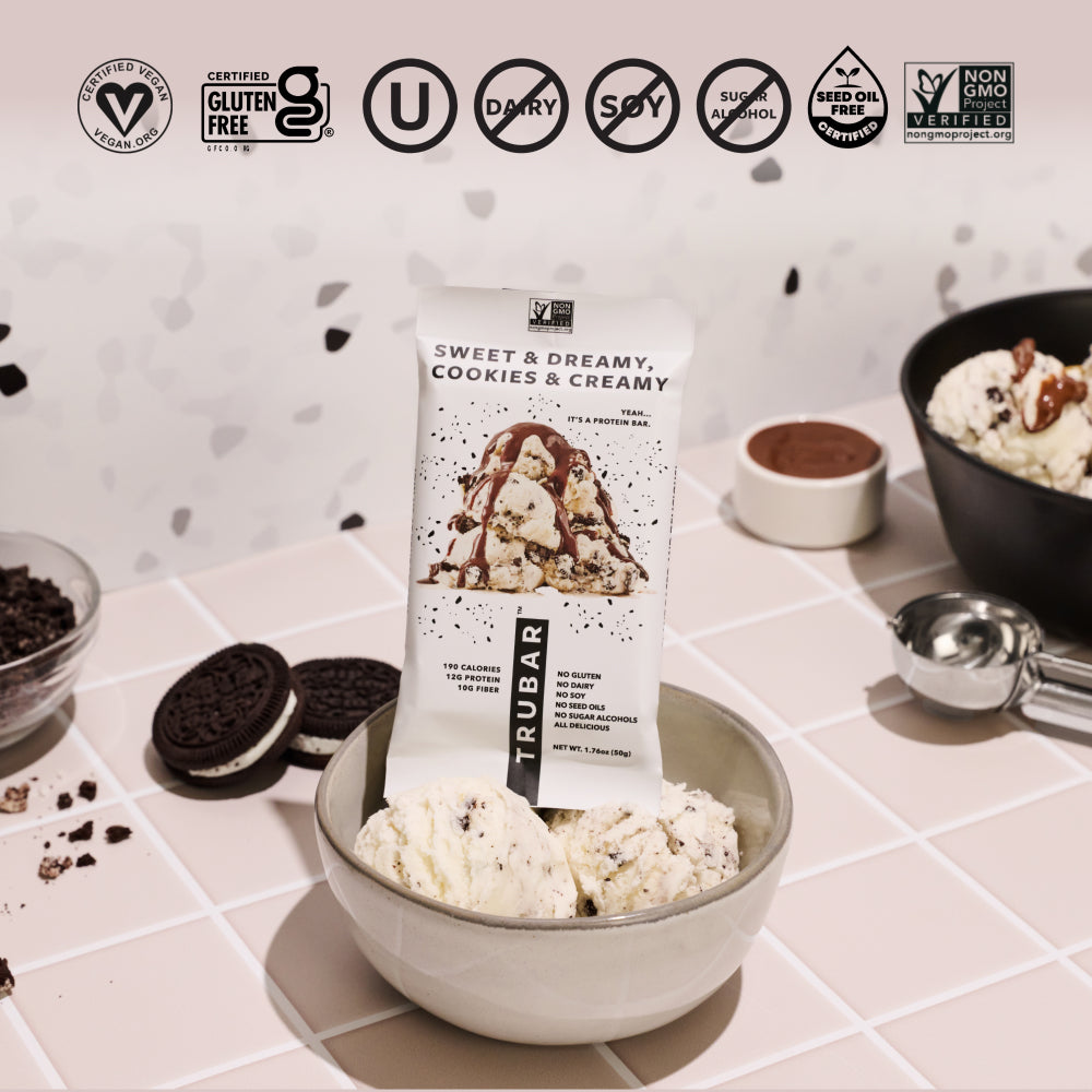 TRUBAR plant-based protein bar pouch with cookies & cream flavor image and health icons