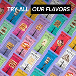 Colorful assortment of TRUBAR protein bar packs on a vibrant display