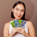 AMRITA chocolate protein bar variety pack held in hands by woman