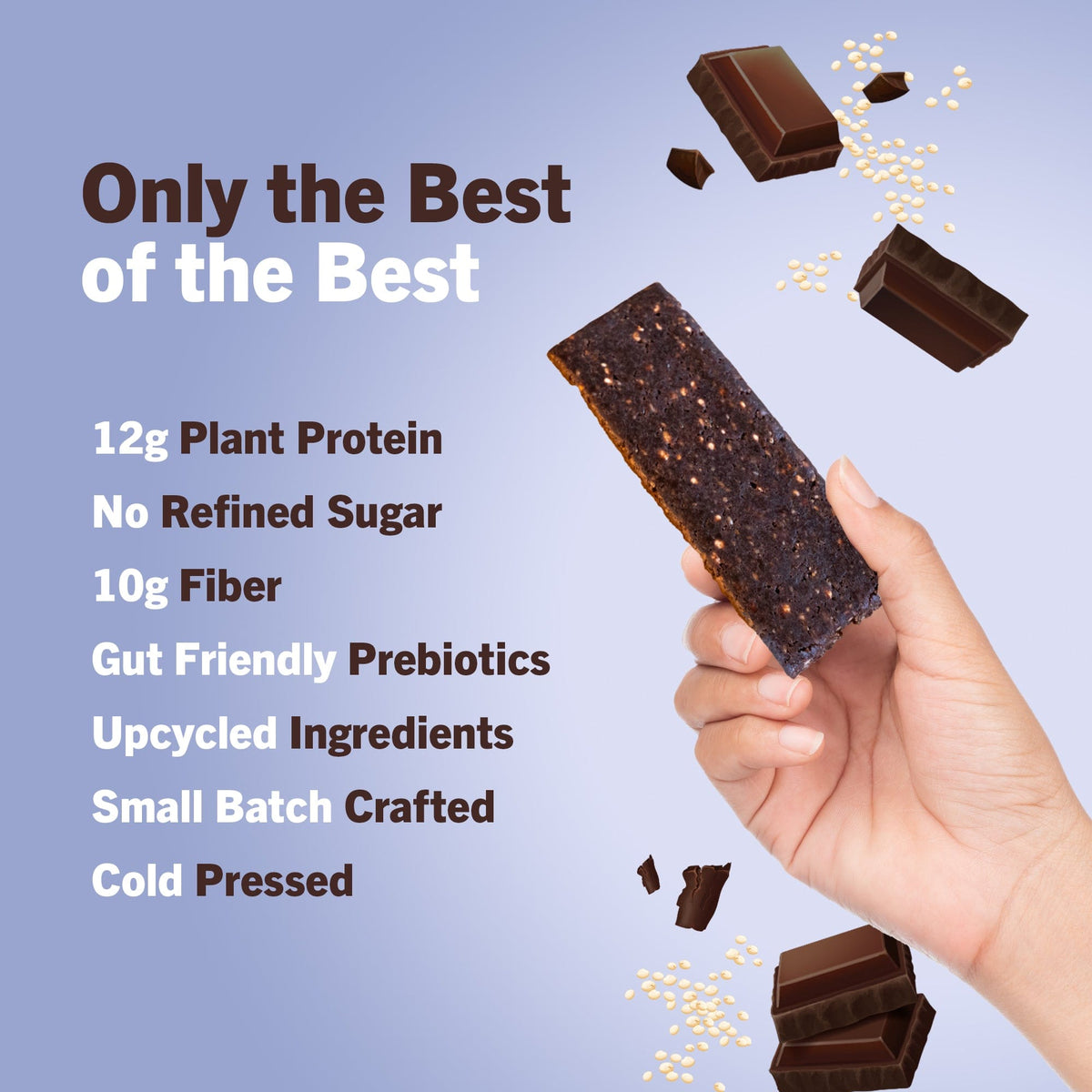 Hand holding a dark chocolate crunch protein bar with chocolate pieces