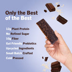 Hand holding a dark chocolate crunch protein bar with chocolate pieces