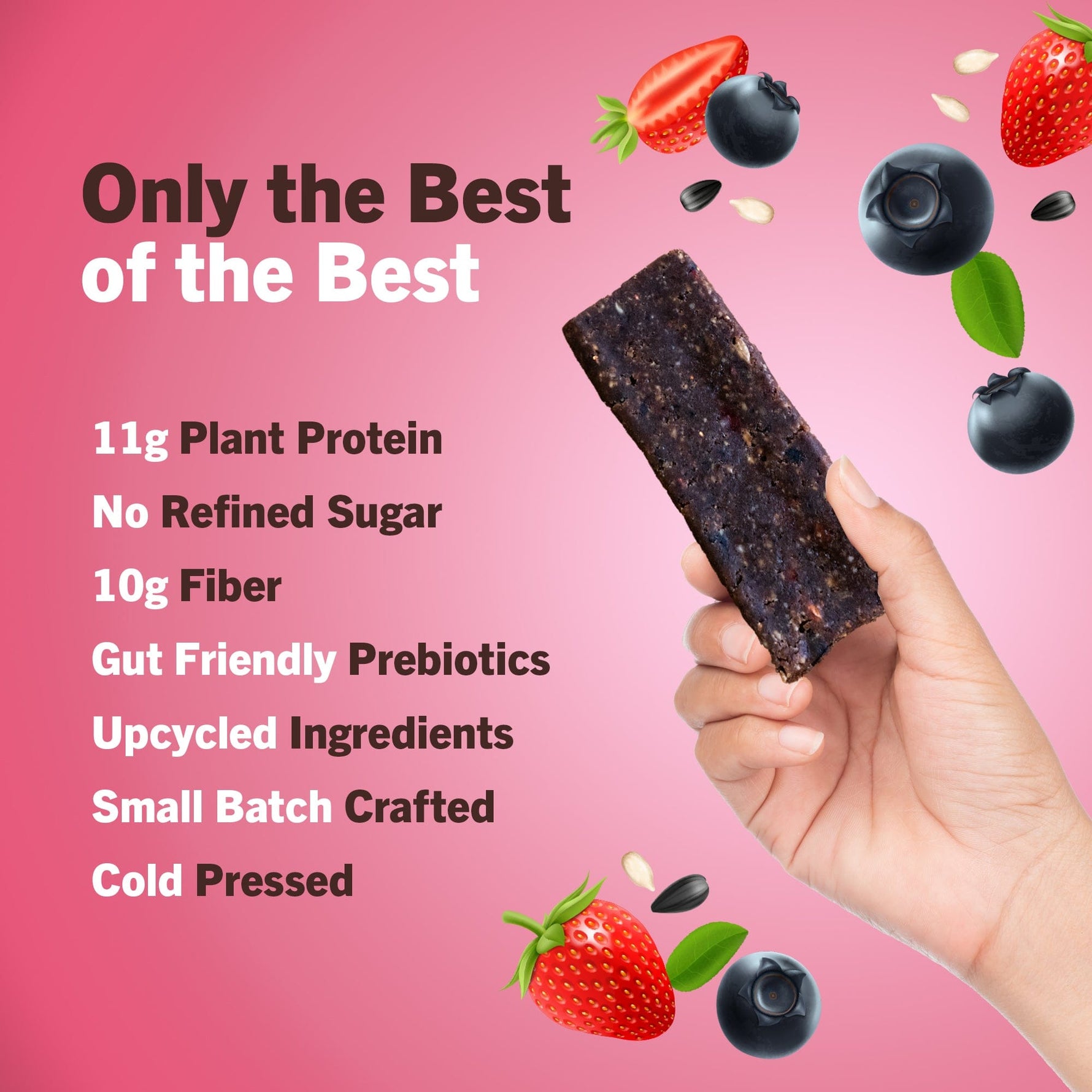 Protein bar held by hand; dark bar texture with AMRITA packaging